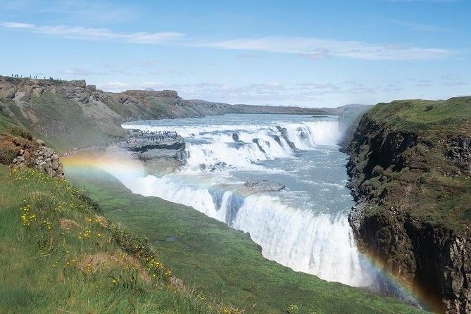 Gullfoss running into its canyon with a rainbow in the spray
