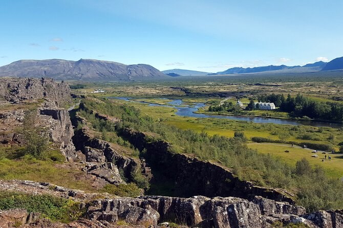 The rift valley at Thingvellir, lava ridges in front and a river winding below