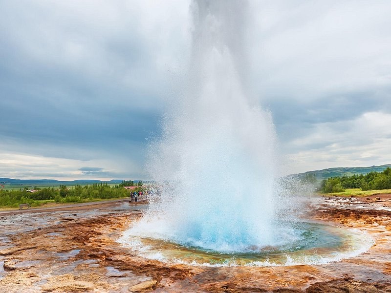 A close view of Strokkur's column bursting out of its pool
